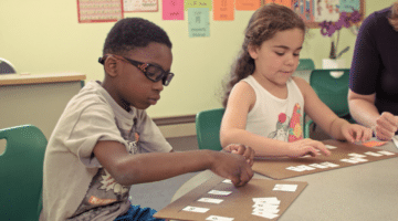 Students working with Switch It activity at small group table.