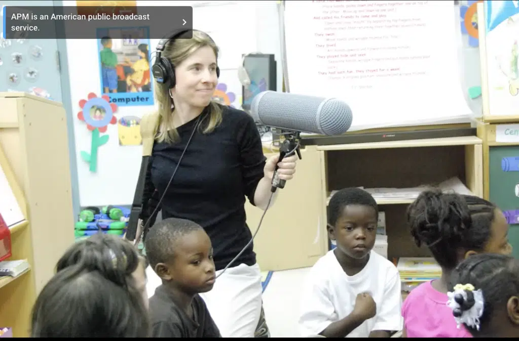 Journalist Emily Hanford recording audio in a classroom