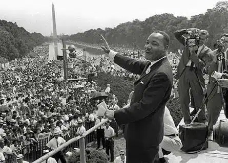 Dr. Martin Luther King, Jr. behind the podium speaking during the March on Washington for Jobs and Freedom on August 28, 1963